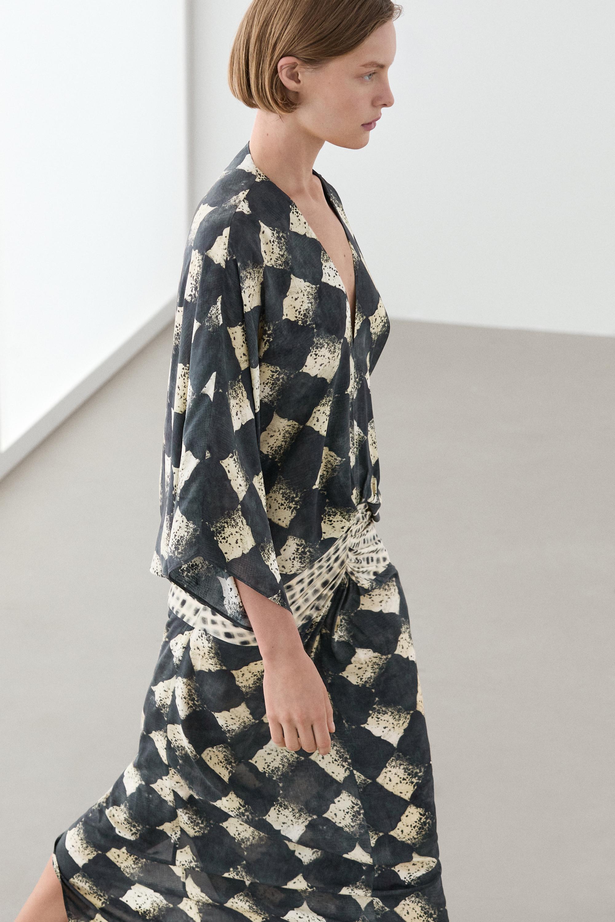 Flowing dress with sash belt detail